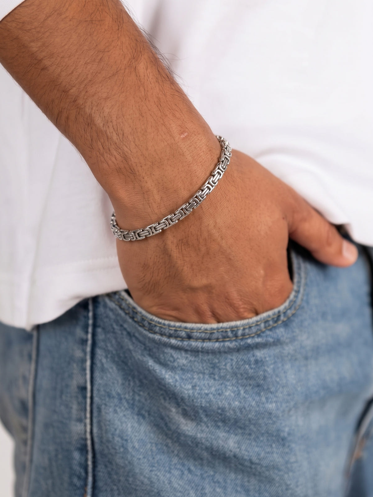King's Link Bracelet Silver Stainless Steel 4mm on the wrist, worn with a white T-shirt and jeans