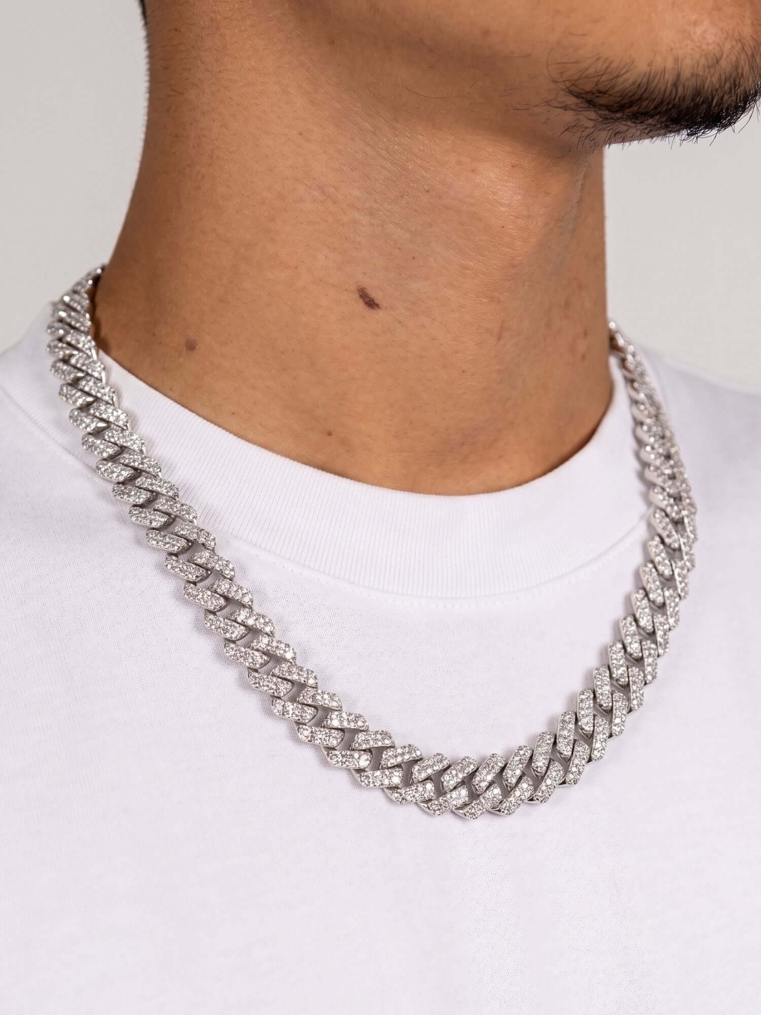 Moissanite Cuban Link Necklace 925 Silver ICED OUT (12mm) with sparkling stones on a white background.