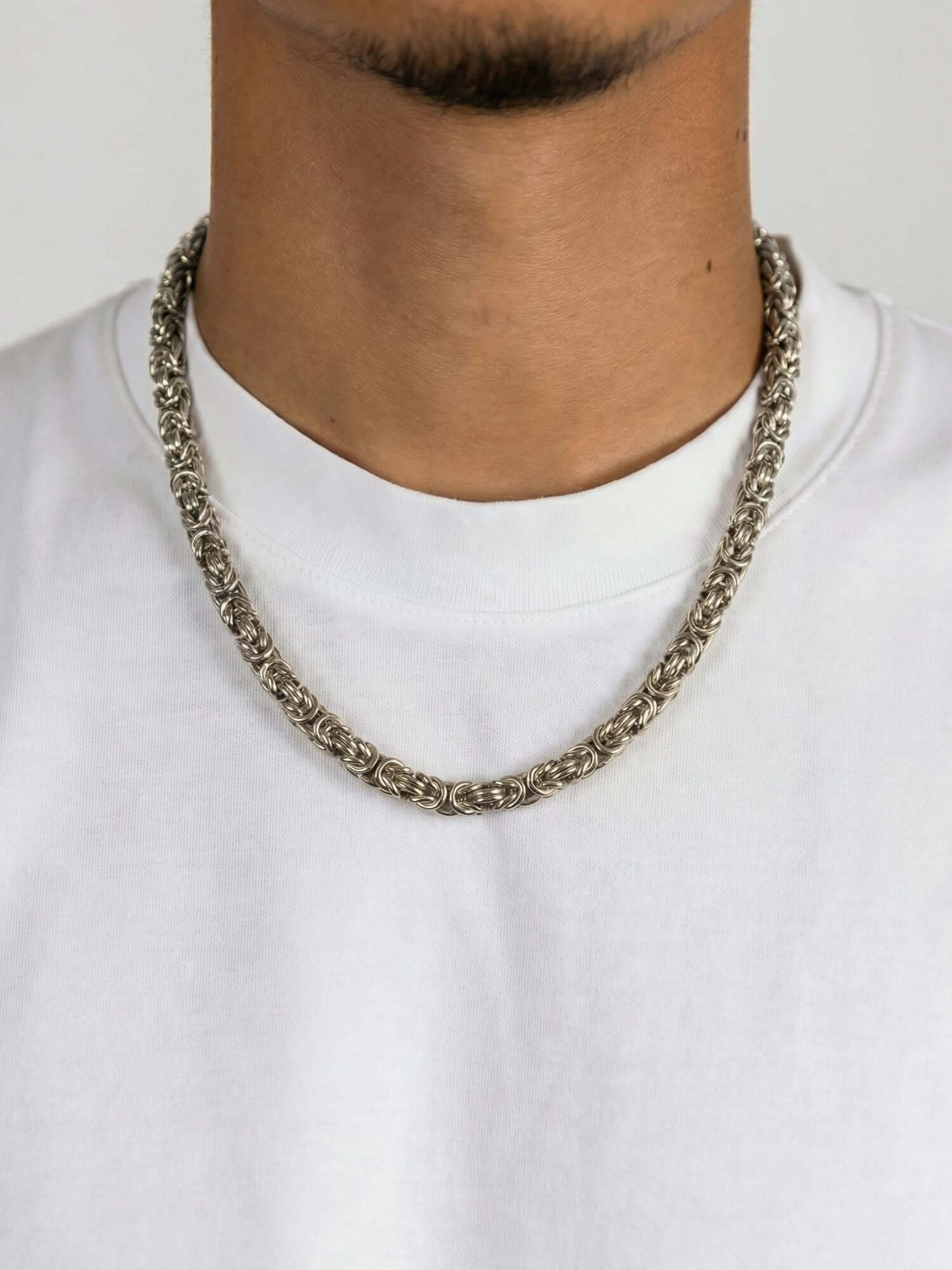 Silver Byzantine king chain 6MM worn by model, elegant and timeless design.